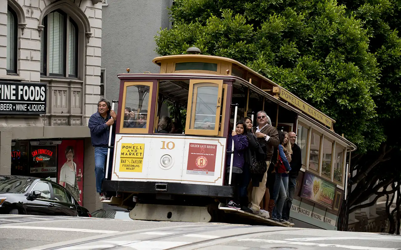 Vintage San Francisco cable cars travelling uphill
