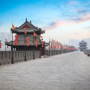 Exploring the Ancient City Wall of Xi Ancient city wall with historic buildings and flags in Xi