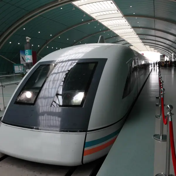 High-speed train waiting at a modern station